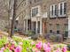 A vibrant display of pink azaleas and lush greenery enhance the townhome community's curb appeal at 2168 Rock Creek Park, Decatur, GA 30033