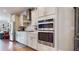 Well-appointed kitchen boasts stainless steel appliances, ample cabinetry, and sleek countertops, perfect for culinary enthusiasts at 2168 Rock Creek Park, Decatur, GA 30033