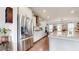 Modern kitchen with stainless steel refrigerator, white cabinetry, and a view of the dining area, creating an inviting atmosphere at 2168 Rock Creek Park, Decatur, GA 30033