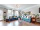 Bright and airy living room with hardwood floors, modern lighting, and comfortable seating arrangement at 2168 Rock Creek Park, Decatur, GA 30033
