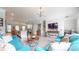 Open-concept living space with hardwood floors, modern lighting, and a seamless flow to the staircase at 2168 Rock Creek Park, Decatur, GA 30033