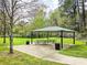 Community picnic pavilion with tables and trash cans on a manicured lawn at 2168 Rock Creek Park, Decatur, GA 30033