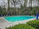 Community pool with lounge chairs and umbrellas, perfect for relaxation and enjoying sunny days with friends and Gathering at 2168 Rock Creek Park, Decatur, GA 30033
