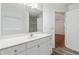 Bright bathroom with a large vanity, ample storage, a sink, and a view of a tiled walk-in shower at 4264 Parks Ridge Dr, Snellville, GA 30039