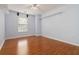 Bedroom featuring hardwood floors, bright natural light, and closet space, and ceiling fan at 4264 Parks Ridge Dr, Snellville, GA 30039