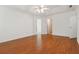 Spacious bedroom with hardwood floors, ceiling fan, and neutral paint, offering a blank canvas for personal design at 4264 Parks Ridge Dr, Snellville, GA 30039
