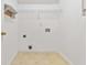 Functional laundry room with shelving and tile flooring, ready for washer and dryer hookups at 4264 Parks Ridge Dr, Snellville, GA 30039