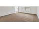 Carpeted living room featuring white walls and a window at 4264 Parks Ridge Dr, Snellville, GA 30039