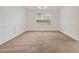 Neutral living room featuring white walls, carpet, and large windows at 4264 Parks Ridge Dr, Snellville, GA 30039