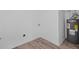 Basement corner features a water heater, clean white walls, neutral trim, and modern wood-look flooring at 799 Kennesaw Dr, Forest Park, GA 30297