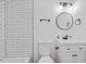 Modern bathroom featuring a stylish vanity and sleek, black fixtures at 799 Kennesaw Dr, Forest Park, GA 30297