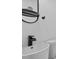 Bathroom with modern sink, toilet, mirror and a tiled walk-in shower with black fixtures at 799 Kennesaw Dr, Forest Park, GA 30297