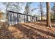 Home exterior showcasing a spacious yard and mature trees at 799 Kennesaw Dr, Forest Park, GA 30297