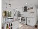 Modern kitchen featuring stainless steel appliances, white cabinets and an island with granite countertops at 799 Kennesaw Dr, Forest Park, GA 30297