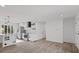 Modern kitchen featuring stainless steel appliances, an island, white cabinets and tile backsplash at 799 Kennesaw Dr, Forest Park, GA 30297