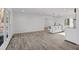 Bright and airy living room featuring wood floors and a modern kitchen island at 799 Kennesaw Dr, Forest Park, GA 30297