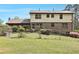 Spacious backyard with a well-maintained lawn, partial fence, and mature landscaping providing privacy at 1757 Colonial South Sw Dr, Conyers, GA 30094