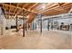Unfinished basement space with exposed ceiling, steel beams, and concrete floor, perfect for customization at 1757 Colonial South Sw Dr, Conyers, GA 30094