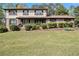 Charming two-story home with a covered front porch and well-maintained landscaping at 1757 Colonial South Sw Dr, Conyers, GA 30094