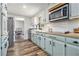 Charming kitchen with butcher block countertops, white subway tile backsplash, and stainless steel appliances at 1757 Colonial South Sw Dr, Conyers, GA 30094