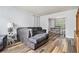 Comfortable living room with a sectional sofa and view to the dining room at 1757 Colonial South Sw Dr, Conyers, GA 30094