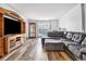 Spacious living room with a large sectional sofa and entertainment center at 1757 Colonial South Sw Dr, Conyers, GA 30094