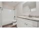 Bright bathroom featuring white cabinets, granite countertop, and combination tub and shower at 1945 Chateau Ln, Lithia Springs, GA 30122