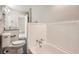 This bright bathroom features granite countertops, white cabinets, and a shower/tub combo at 1945 Chateau Ln, Lithia Springs, GA 30122