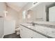Well-lit bathroom featuring a granite vanity, white cabinetry, and a shower at 1945 Chateau Ln, Lithia Springs, GA 30122