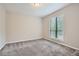 Neutral bedroom with plush carpeting and bright natural light at 1945 Chateau Ln, Lithia Springs, GA 30122