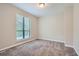 Neutral bedroom with plush carpeting and natural light at 1945 Chateau Ln, Lithia Springs, GA 30122