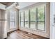 Eat-in kitchen area with wood-look flooring and plenty of natural light at 1945 Chateau Ln, Lithia Springs, GA 30122
