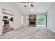Spacious living room with a stone fireplace, sliding doors to the exterior, and open access to the kitchen at 1945 Chateau Ln, Lithia Springs, GA 30122