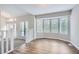 Bright living room with luxury vinyl plank flooring, bay window, and white trim at 1945 Chateau Ln, Lithia Springs, GA 30122