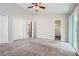 Large main bedroom featuring neutral paint, plush carpet, and natural light at 1945 Chateau Ln, Lithia Springs, GA 30122