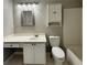 Bathroom featuring a vanity, medicine cabinet, and a toilet next to the tub at 4645 Valais Ct # 121, Alpharetta, GA 30022