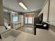 Kitchen with stainless steel appliances and tiled floors is open to the stairs at 4645 Valais Ct # 121, Alpharetta, GA 30022