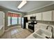 Bright kitchen with white cabinets, stainless steel appliances, and a breakfast nook at 4645 Valais Ct # 121, Alpharetta, GA 30022