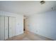 Empty bedroom featuring white walls, neutral carpeting, and a closet at 154 Weatherly Way, Alpharetta, GA 30009