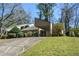 Charming single-story home featuring a covered carport and mature landscaping in a nice neighborhood at 154 Weatherly Way, Alpharetta, GA 30009