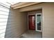 Close-up of front entry with red front door and storm door at 154 Weatherly Way, Alpharetta, GA 30009