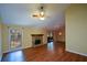 Inviting living room with fireplace, hardwood floors and natural light at 154 Weatherly Way, Alpharetta, GA 30009