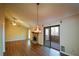 Bright living room boasts a stone fireplace, ceiling fan, and sliding door leading to outdoor space at 154 Weatherly Way, Alpharetta, GA 30009