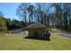 Charming pool house near the pool area, set amidst a lush green lawn and mature trees at 154 Weatherly Way, Alpharetta, GA 30009