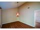 Spacious room with wood floors, vintage light fixture, and unique floral wallpaper accent wall at 154 Weatherly Way, Alpharetta, GA 30009