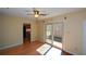 Sunlit room features wood floors and a sliding glass door leading to the outdoor area at 154 Weatherly Way, Alpharetta, GA 30009