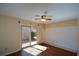 Well-lit room showcases wood floors and a sliding glass door for easy outdoor access at 154 Weatherly Way, Alpharetta, GA 30009