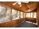 Cozy screened porch with wood paneling and ceiling fans, perfect for enjoying the outdoors at 154 Weatherly Way, Alpharetta, GA 30009