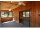 Inviting screened porch with ceiling fans, wood accents, and sliding door access to the indoors at 154 Weatherly Way, Alpharetta, GA 30009