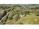 Picturesque aerial view of a private residence with a sprawling lawn, circular driveway, and mature trees at 240 Indian Creek Rd, Locust Grove, GA 30248